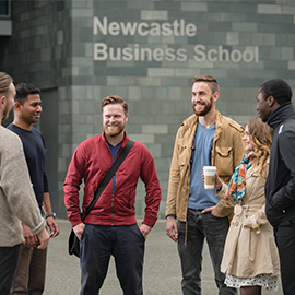 a group of people standing in front of a building