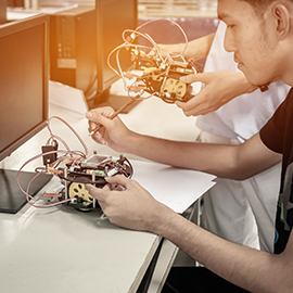a person cutting a cake