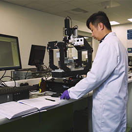 a man standing in a kitchen preparing food