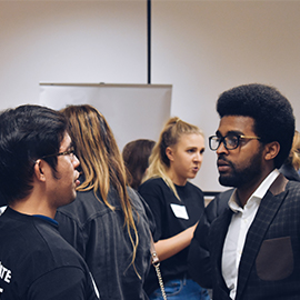 a group of people standing in front of a crowd