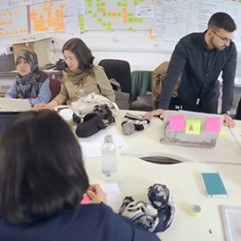 a group of people sitting at a table