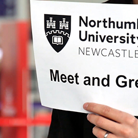 a person holding a sign