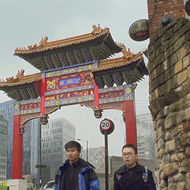 a group of people standing in front of a building