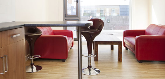 a living room filled with furniture and a large window