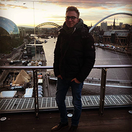 a man standing on a bridge