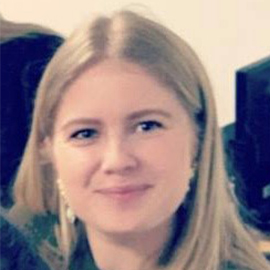 a little girl smiling at the camera