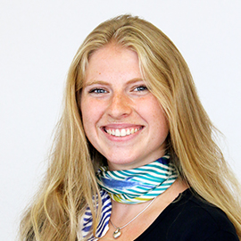 a woman smiling and posing for the camera