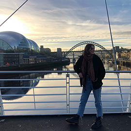 a man standing in front of a bus
