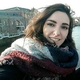 a smiling girl taking a selfie