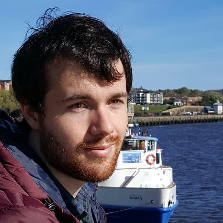 a close up of a man in a boat on the water