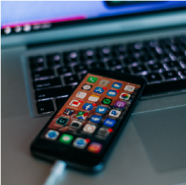 Photo showing phone and laptop