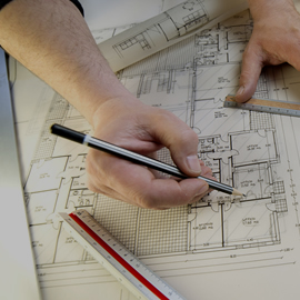 a person cutting a piece of paper