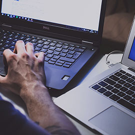 Photo of person working on laptop