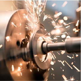 Metalworking industry: finishing metal working internal steel surface on lathe grinder machine with flying sparks