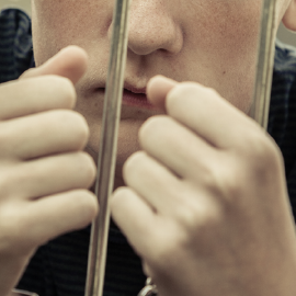 Young person behind bars