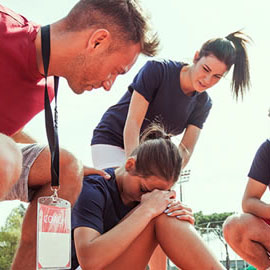 a group of people looking at a phone