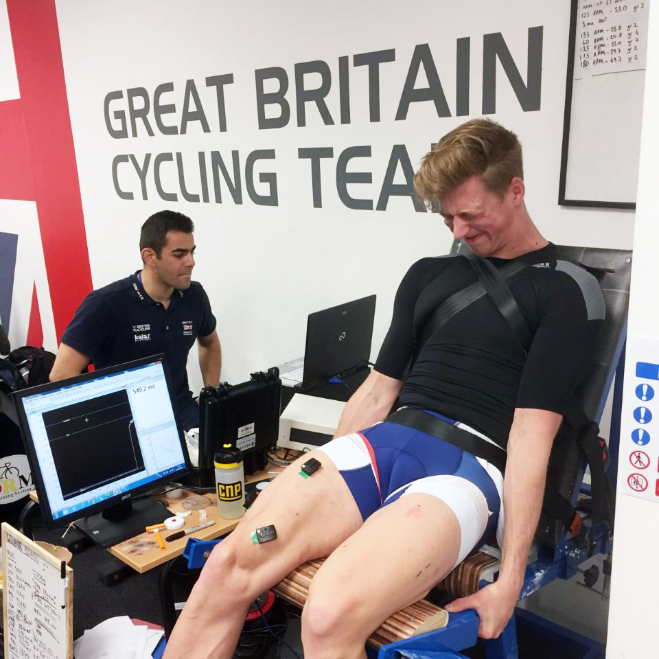 a man sitting in front of a laptop