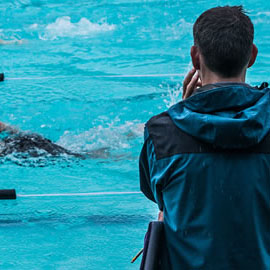a group of people swimming in the water