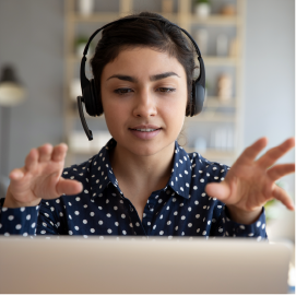 Image showing woman using a headset on a computer