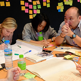 People around a table in discussion