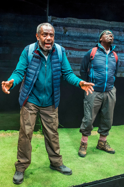 a couple of people that are standing in the grass