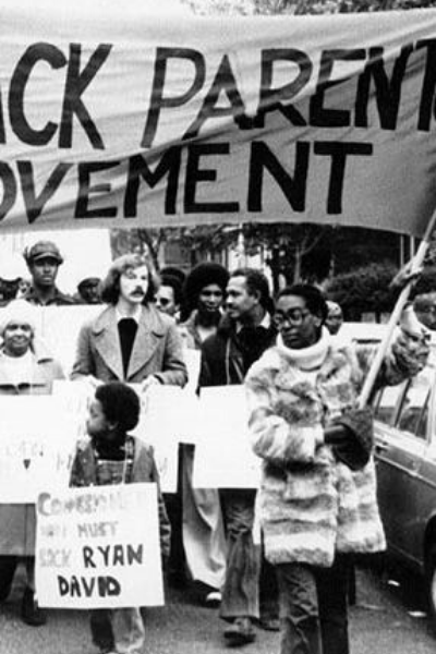 a group of people holding a sign