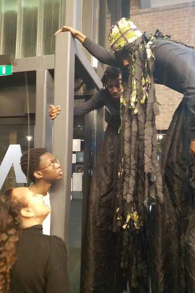 a group of people standing in front of a store