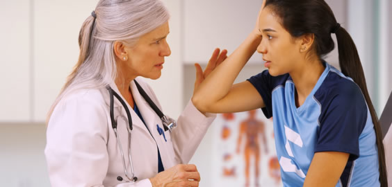 a couple of people standing next to a woman