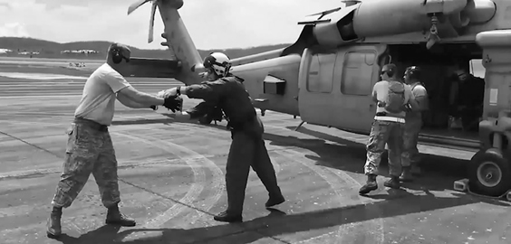 a group of people standing around a plane