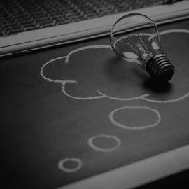 a laptop computer sitting on top of a table
