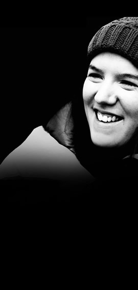 a woman taking a selfie in a dark room