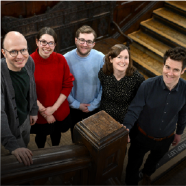 group of people smiling to camera