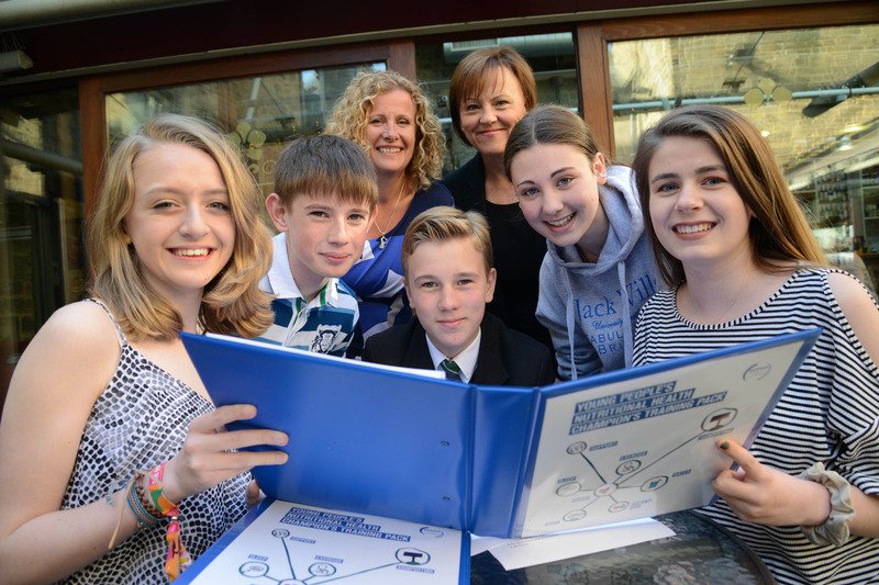 a group of people sitting posing for the camera