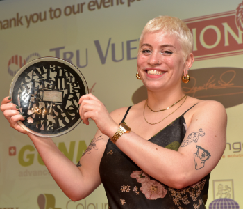 Caption: Sophie Woodward with her Student Artist of the Year award from the Fine Art Trade Guild.