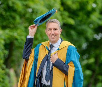 Caption: Michael Brodie CBE, CEO of the NHS Business Services Authority receives Honorary Doctorate of Civil Law from Northumbria University.