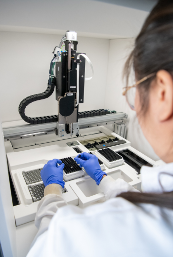 Caption: Kim Nguyen-Phuoc at work in the NU-OMICS DNA sequencing facility.