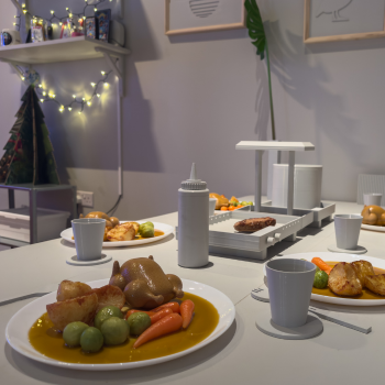 Caption: A Winter Festival family meal in the Innovo Room of the Future.