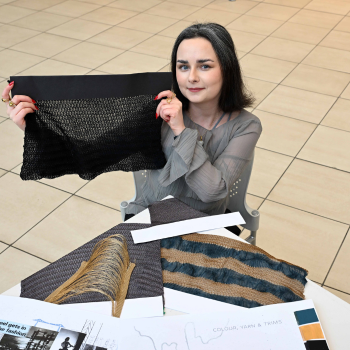 Caption:Fashion student Beth Young pictured with some of her work
