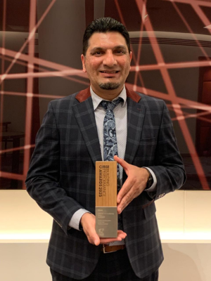 caption:Dr Muhammad Wakil Shahzad Dr Muhammad Wakil Shahzad holding the Innovation of the Year Award at the CIBSE Awards 2025