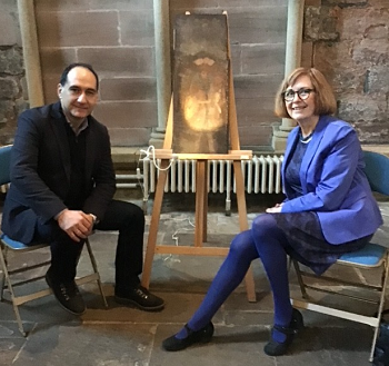 Caption:Dr Charis Theodorakopoulos pictured with art historian Dr Sophie Oostevijk and the fifth panel in the North Transept of the Abbey. Photo by Molly Cady