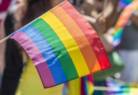 a person holding a colorful umbrella