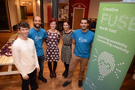 a group of people posing for the camera