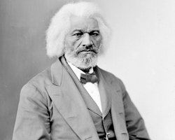 Frederick Douglass wearing a suit and tie