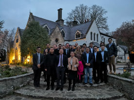 a group of people standing in front of a building