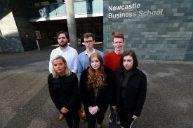 a group of people standing in front of a building