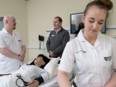 Caption: Chris Pointon meeting first year students David Simpson and Alicja Kleysa