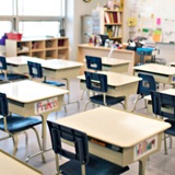 an office with a desk and chair in a room