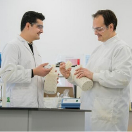 a group of people holding wine glasses