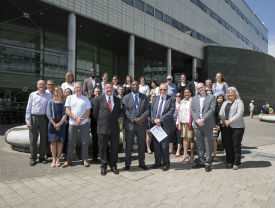 a group of people standing in front of a building