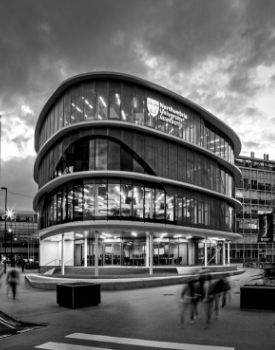a double decker bus driving down a street
